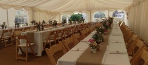 wooden chairs and trestle tables